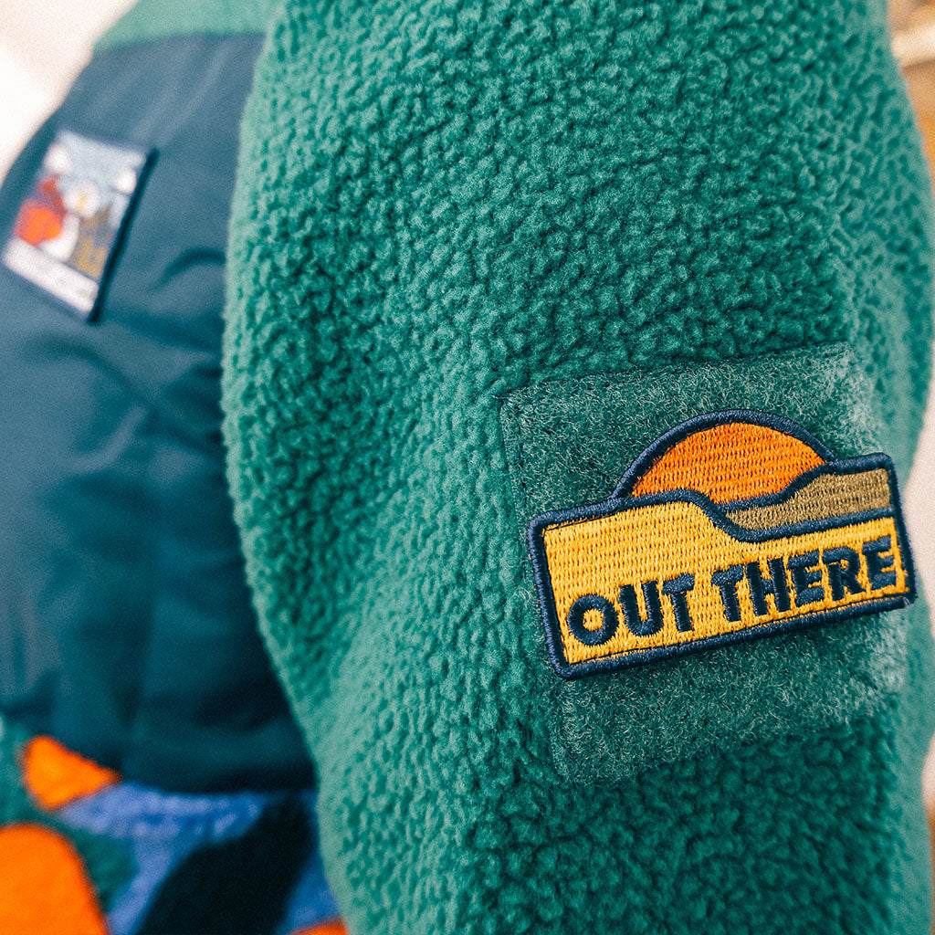 Out There Hooded Recycled Sherpa Fleece Jacket (Banana Camo Forest/Orange)