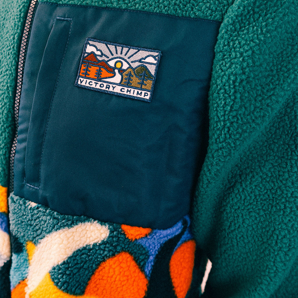 Out There Hooded Recycled Sherpa Fleece Jacket (Banana Camo Forest/Orange)