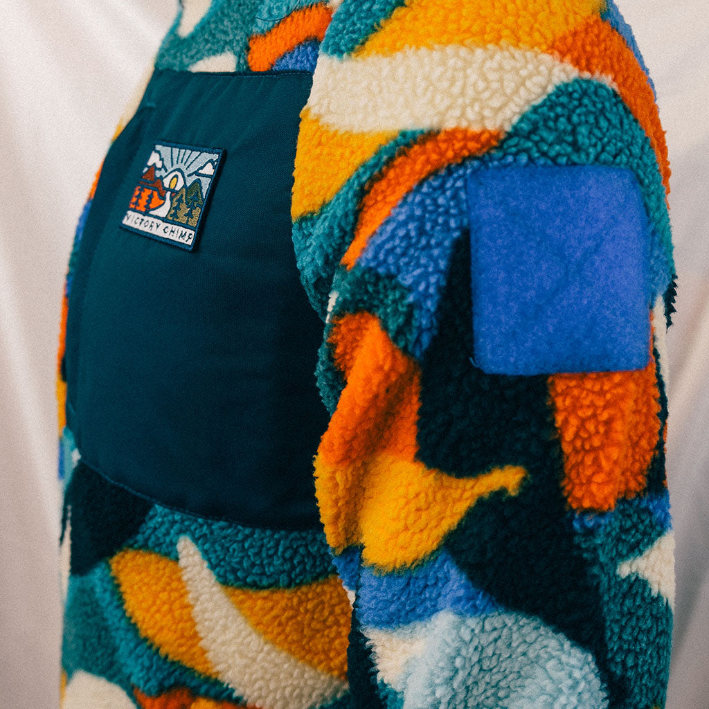 Out There Recycled Sherpa Fleece (Banana Camo Forest/Orange)