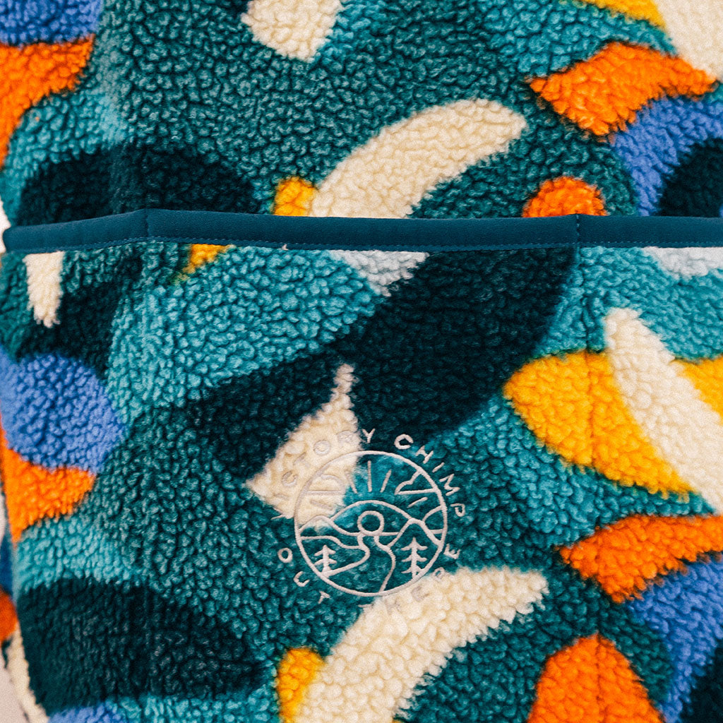 Out There Recycled Sherpa Fleece (Banana Camo Forest/Orange)