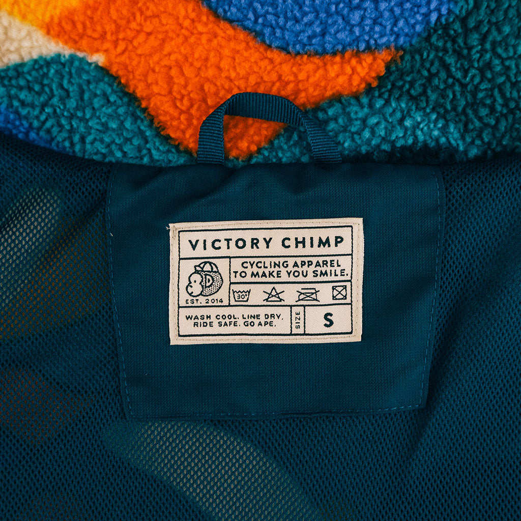 Out There Recycled Sherpa Fleece (Banana Camo Forest/Orange)