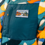 Out There Recycled Sherpa Fleece (Banana Camo Forest/Orange)